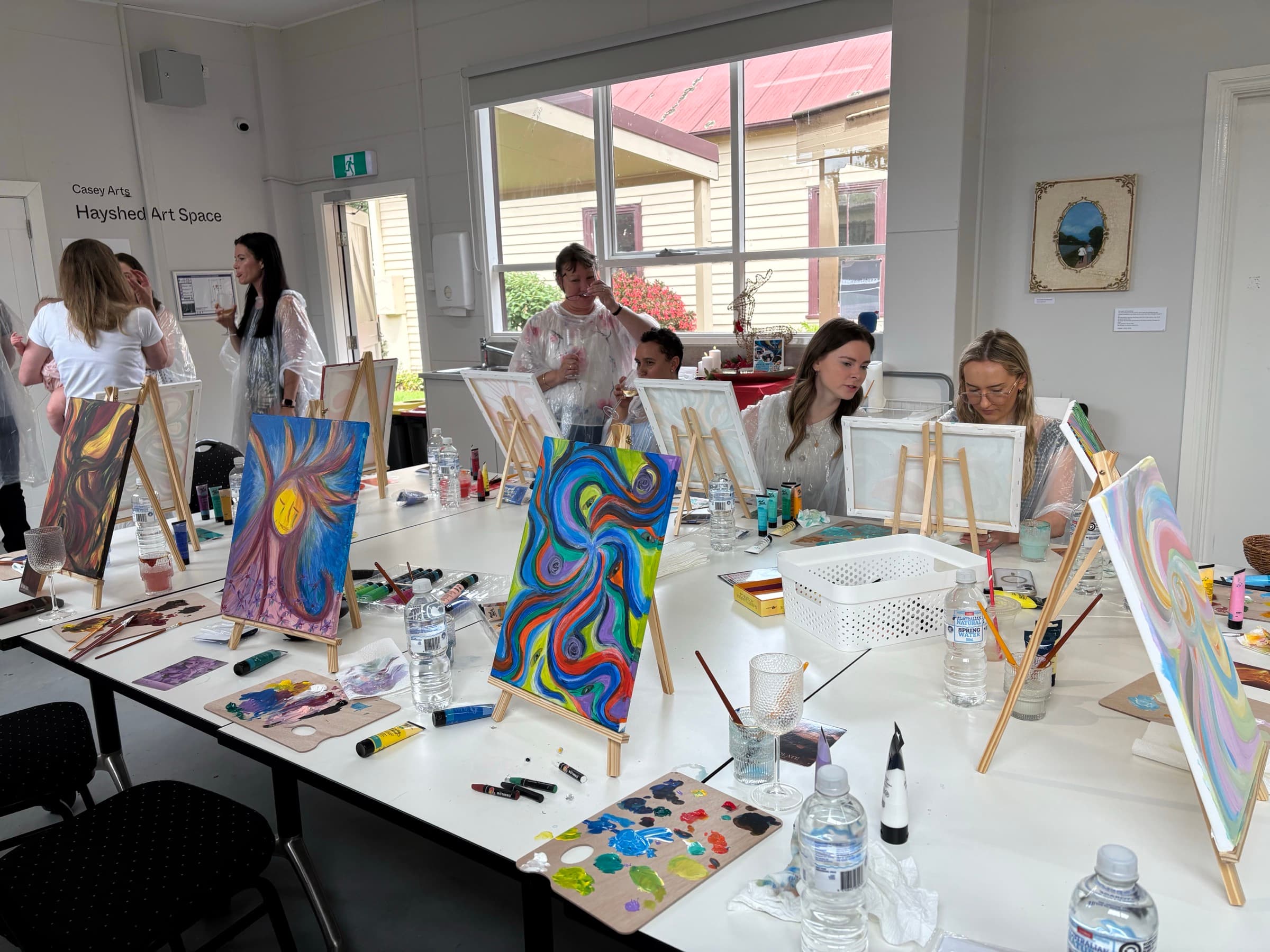 Group painting workshop in progress
